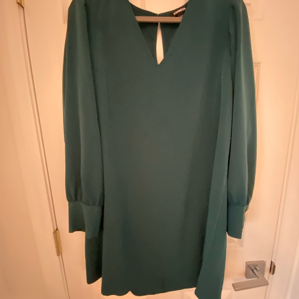 Green long sleeve with gold accent on wrist